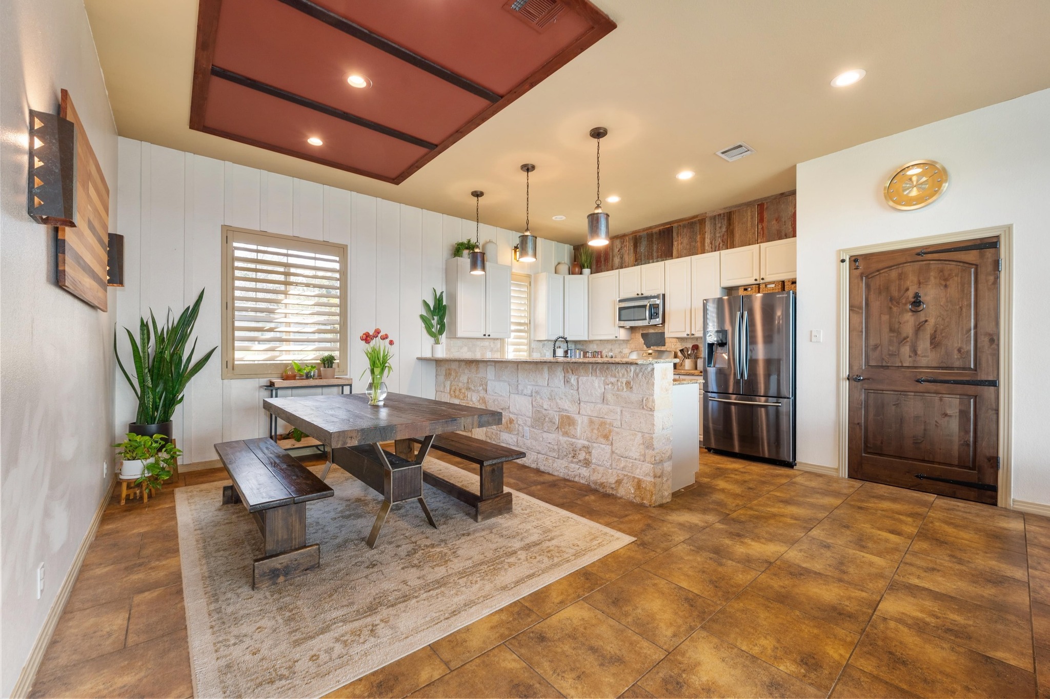 13602 Couri Pass Austin, TX 78738 - Photo 12 of 36 a kitchen with stainless steel appliances kitchen island granite countertop a refrigerator and a sink