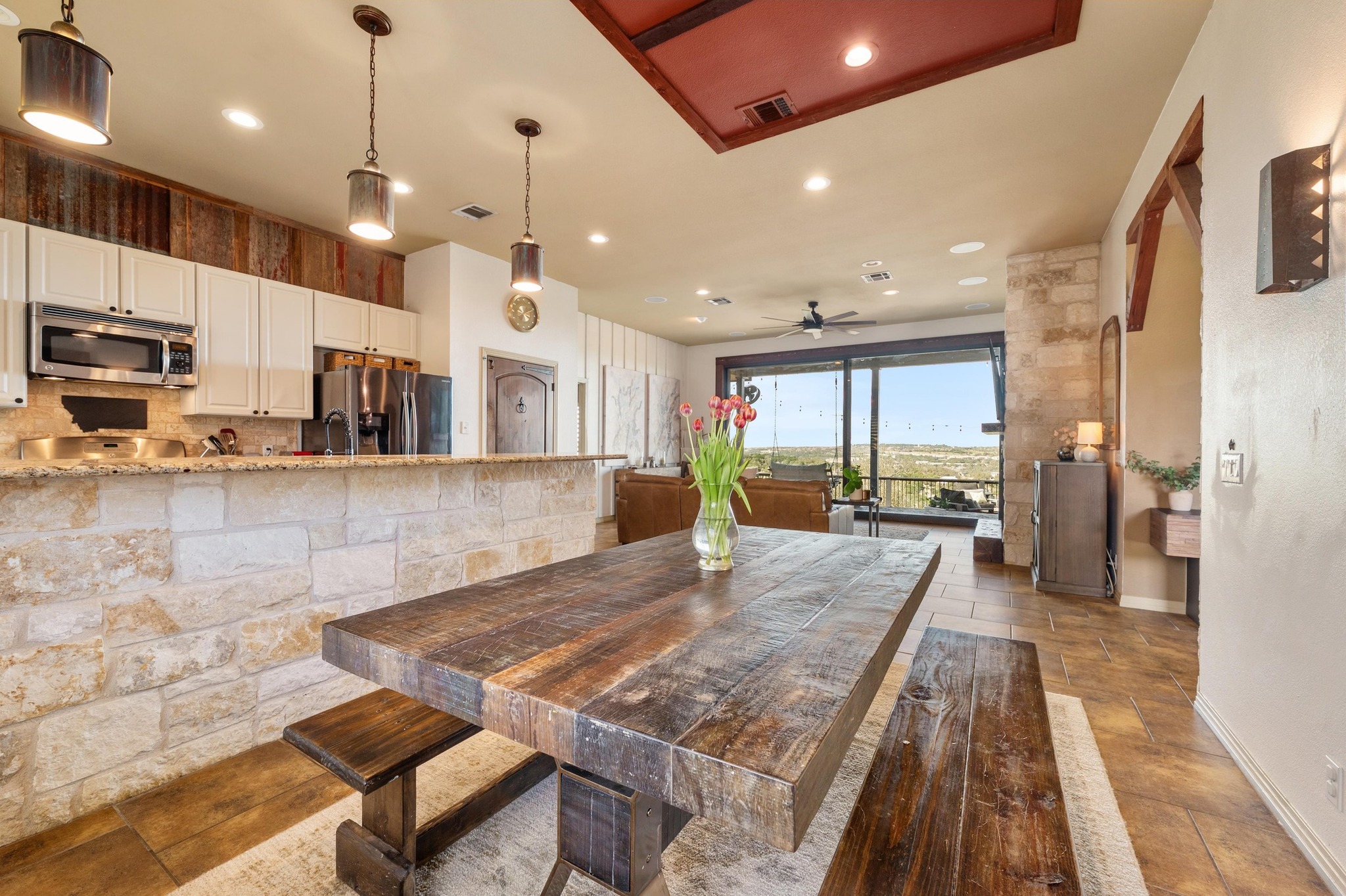 13602 Couri Pass Austin, TX 78738 - Photo 13 of 36 a large kitchen with kitchen island a large counter top stainless steel appliances and cabinets