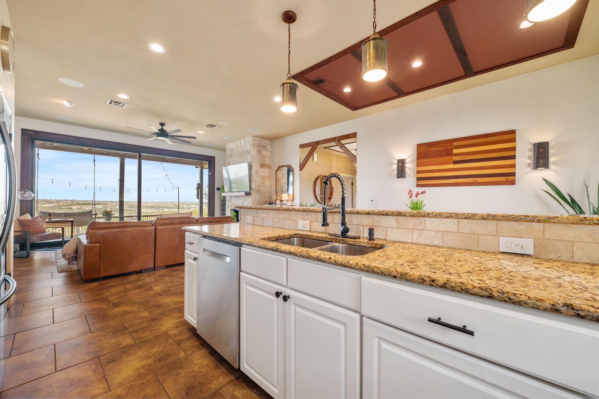 13602 Couri Pass Austin, TX 78738 - Photo 14 of 36 a large kitchen with stainless steel appliances granite countertop a sink and cabinets