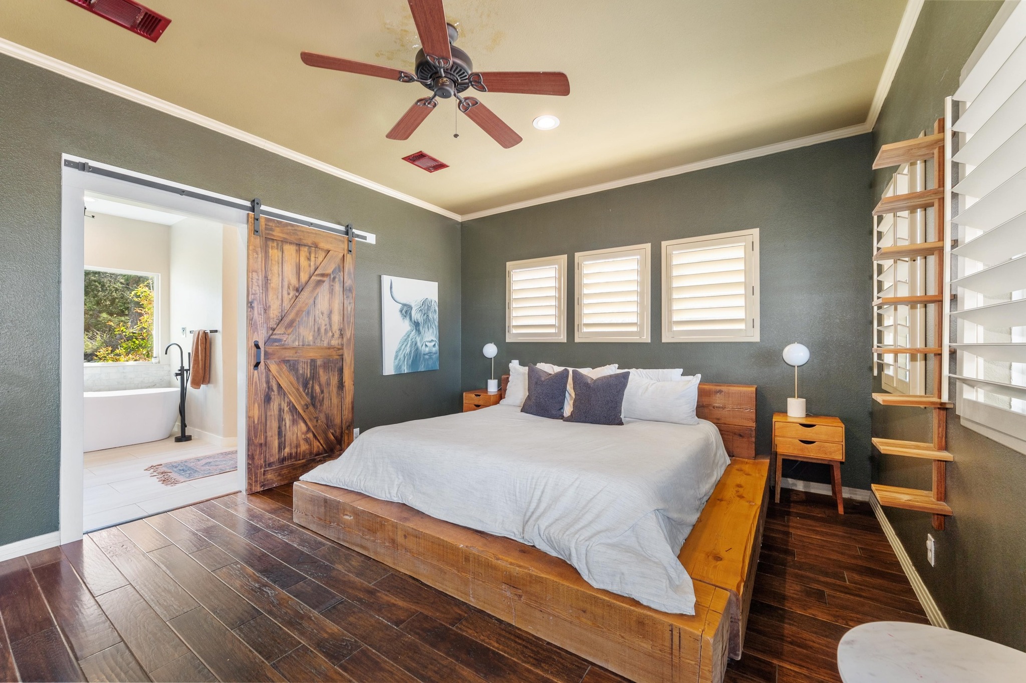 13602 Couri Pass Austin, TX 78738 - Photo 19 of 36 a bedroom with a bed and wooden floor