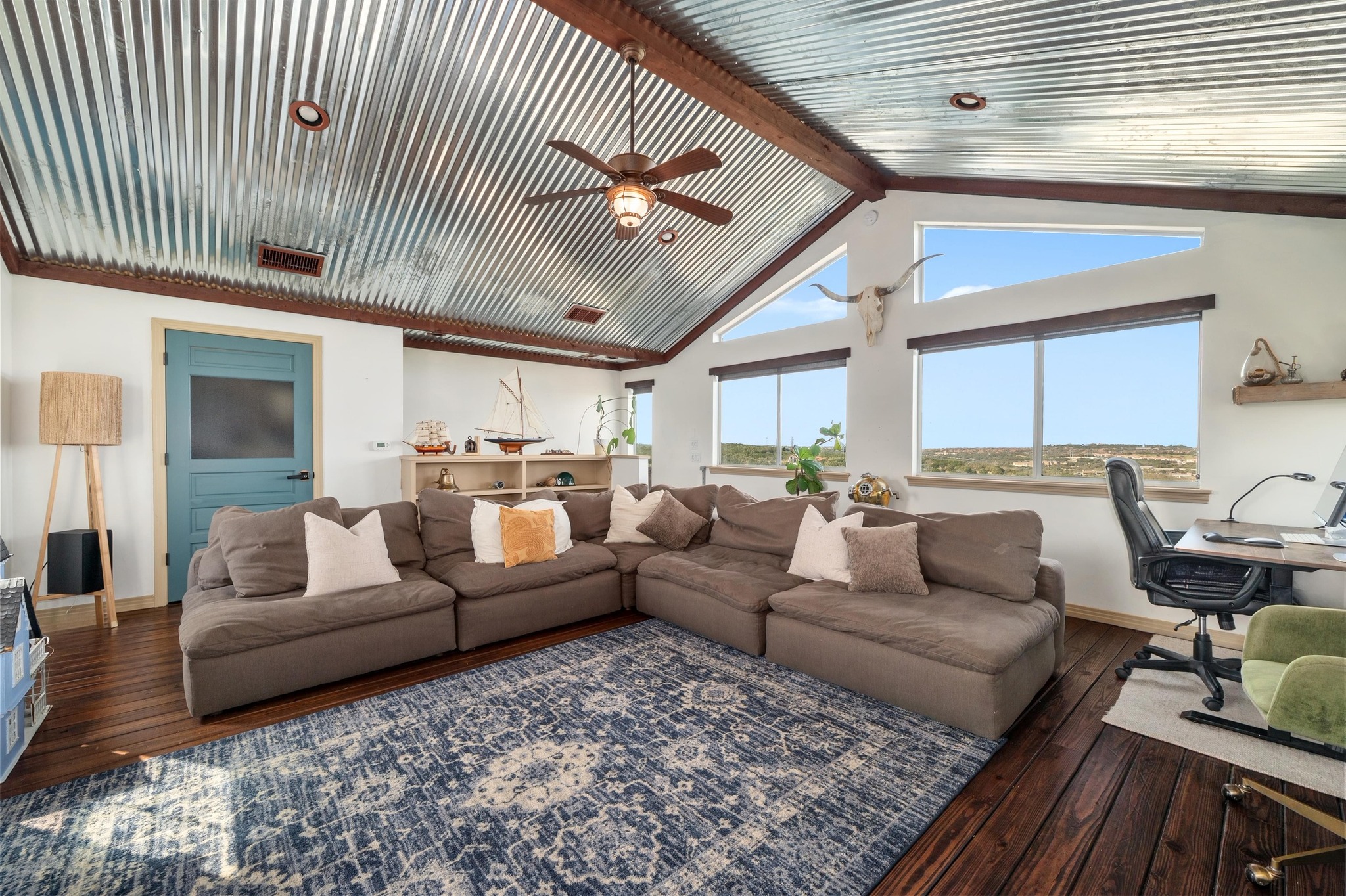 13602 Couri Pass Austin, TX 78738 - Photo 24 of 36 a living room with furniture ceiling fan and a rug