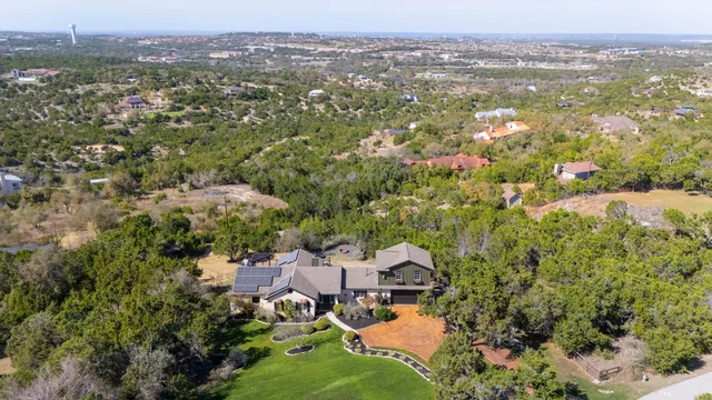 an aerial view of residential house with outdoor space and river