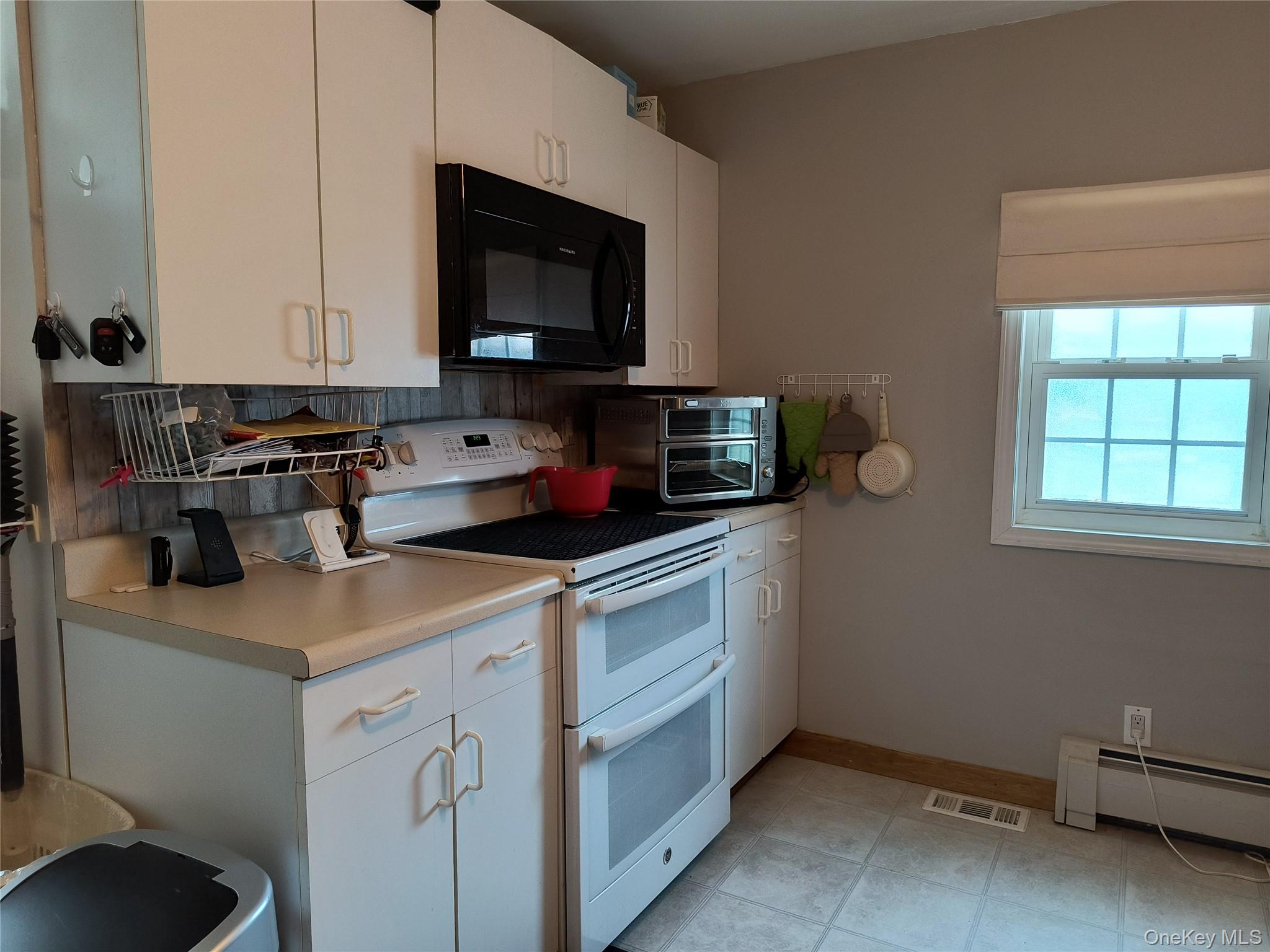 20 Barron Road Montgomery, NY 12549 - Photo 5 of 30 a kitchen with a sink cabinets and a microwave