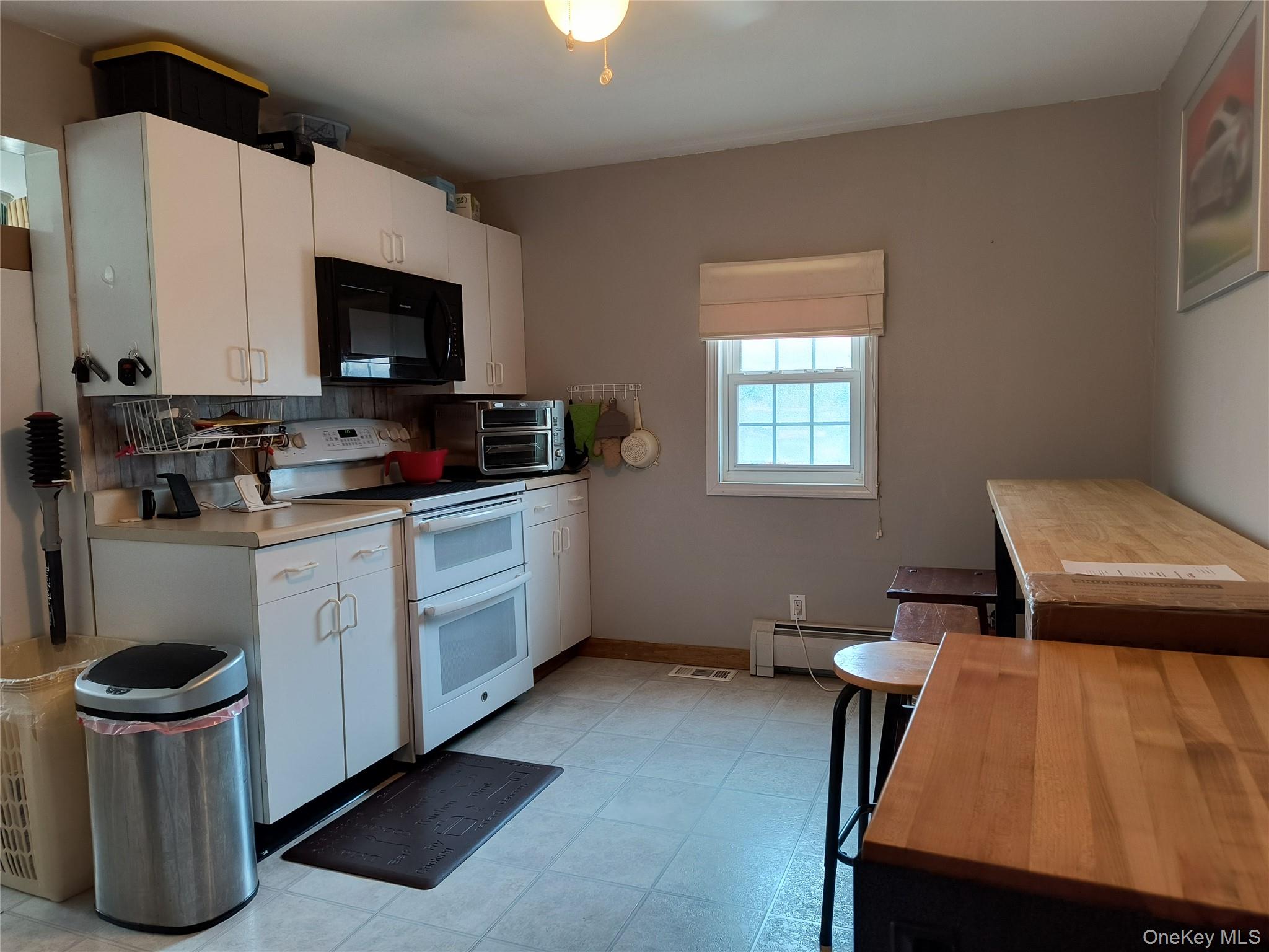 20 Barron Road Montgomery, NY 12549 - Photo 7 of 30 a kitchen with a stove a sink and a table