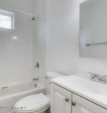 a bathroom with a sink a toilet and a bathtub