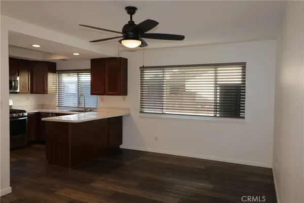 a kitchen with a refrigerator and a sink
