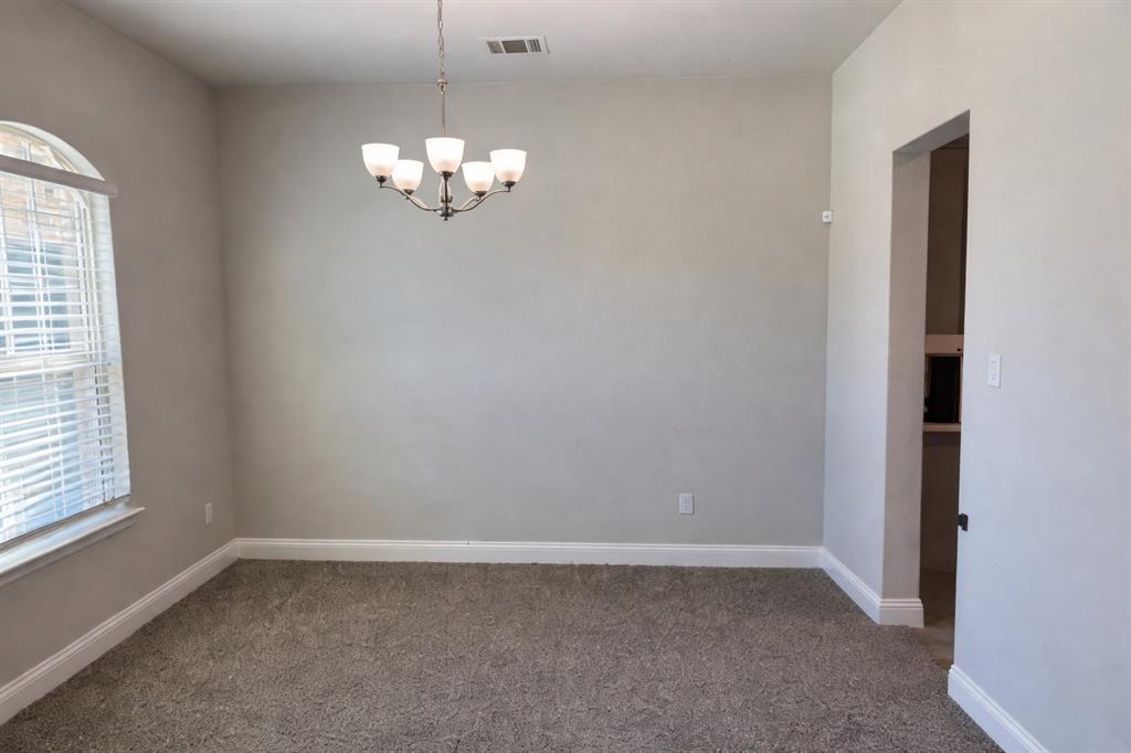 10638 Cherry Tree Way Grand Prairie, TX 76065 - Photo 10 of 39 Formal dining room un-staged; use as a craft room or whatever you need!