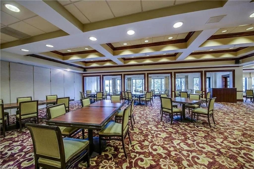 20751 Rivers Ford Estero, FL 33928 - Photo 35 of 36 Dining room with carpet floors, a decorative wall, coffered ceiling, and beam ceiling