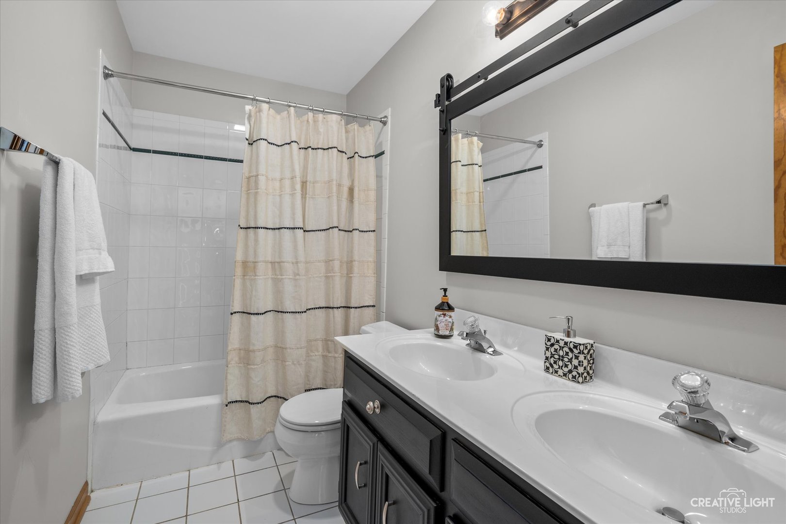 1135 Conan Doyle Road Naperville, IL 60564 - Photo 25 of 47 a bathroom with a sink toilet double vanity and shower