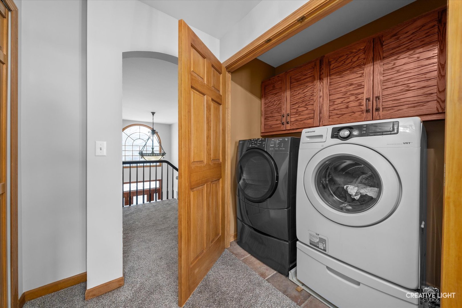 1135 Conan Doyle Road Naperville, IL 60564 - Photo 26 of 47 a view of a hallway with washer and dryer