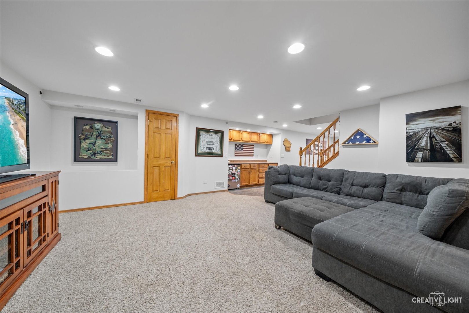 1135 Conan Doyle Road Naperville, IL 60564 - Photo 29 of 47 a living room with furniture and a wooden floor