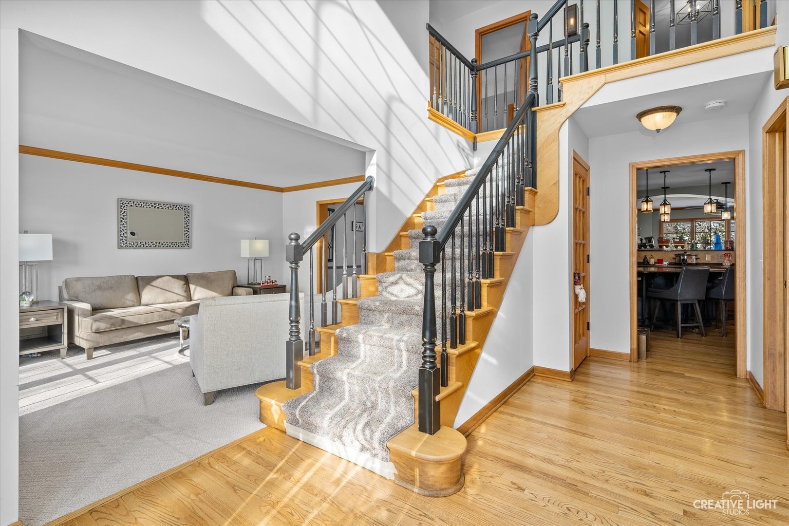 1135 Conan Doyle Road Naperville, IL 60564 - Photo 4 of 47 a living room with furniture and stairs