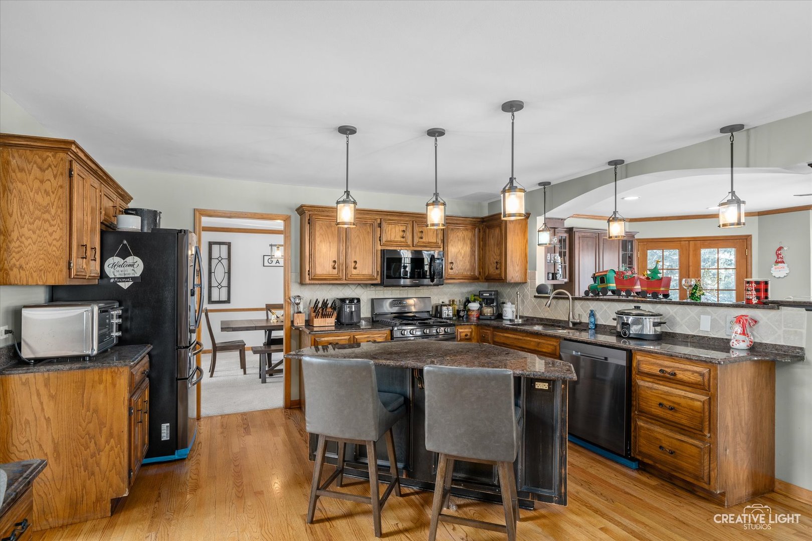 1135 Conan Doyle Road Naperville, IL 60564 - Photo 9 of 47 a dining table with chairs and wooden floor