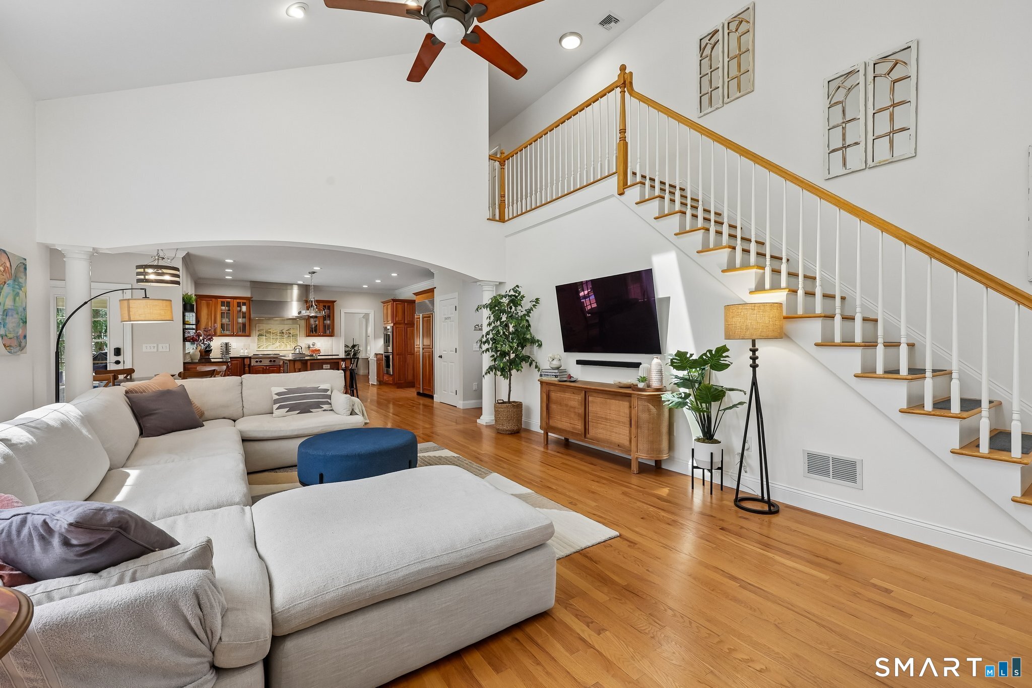 3 East Lake Road Danbury, CT 06811 - Photo 19 of 37 The family room features a convenient rear staircase to the upper level, adding both functionality and an appealing architectural touch to the space.