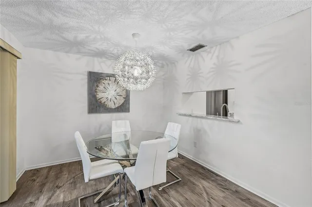 a bedroom with a bed chair and a window