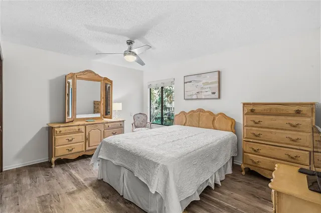 a balcony with wooden benches and lake view