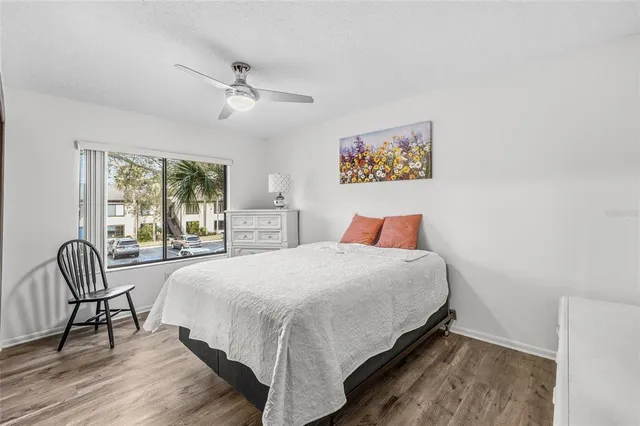 a view of outdoor space with seating area and trees around