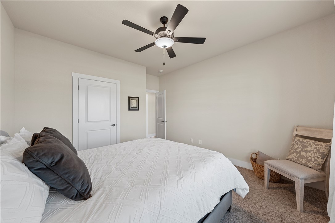 848 Gallant Fox Hewitt, TX 76643 - Photo 23 of 32 a bedroom with a bed and a chair
