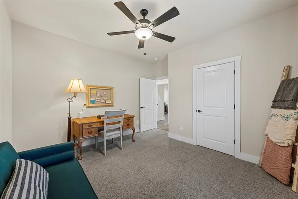 a work room with furniture and a window