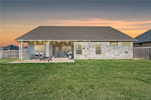 a front view of a house with a garden and porch