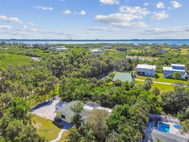 a view of a garden with an ocean and beach
