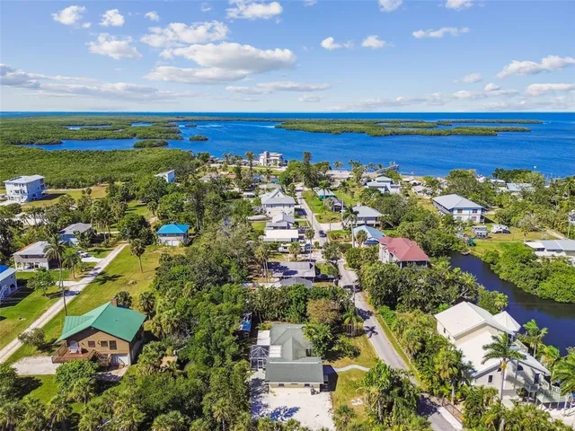 an aerial view of residential building and car parked