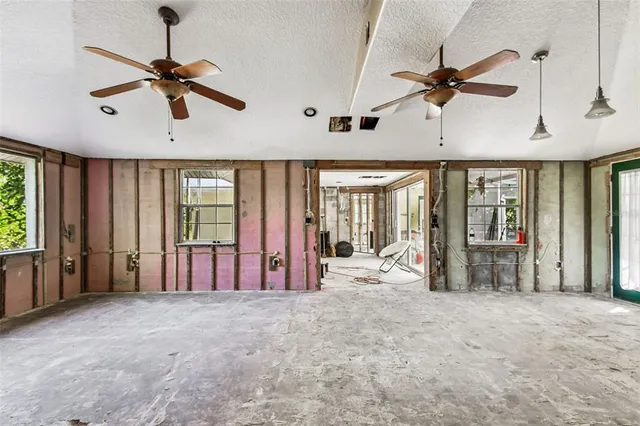 a view of a room with lots of wooden furniture
