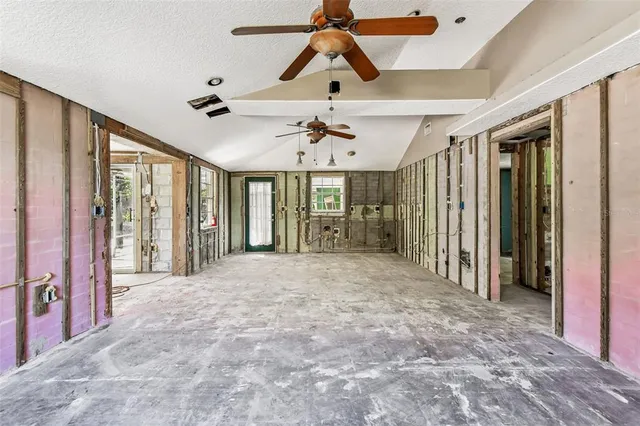a view of an empty room with a large window