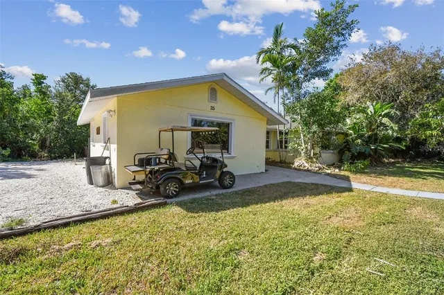 a view of a house with swimming pool and sitting area