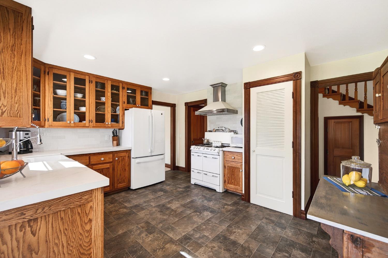 10800 Pickle Barrel Road Auburn, CA 95602 - Photo 19 of 82 a kitchen with a refrigerator a stove top oven a sink and dishwasher