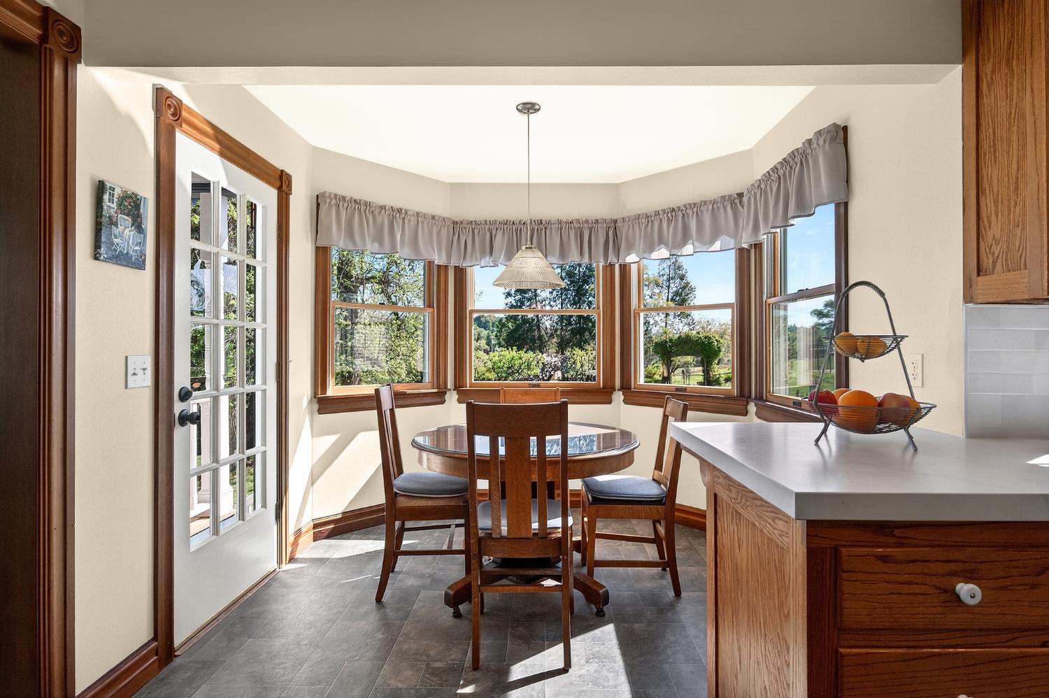 10800 Pickle Barrel Road Auburn, CA 95602 - Photo 20 of 82 a dining room with furniture a chandelier and wooden floor