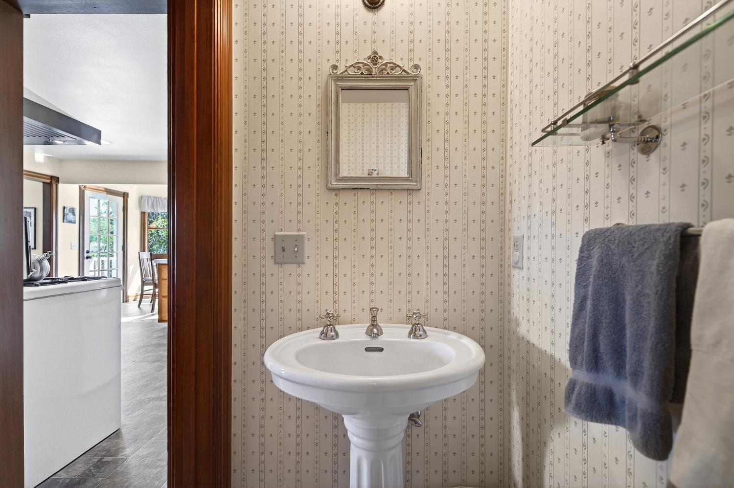 10800 Pickle Barrel Road Auburn, CA 95602 - Photo 23 of 82 a bathroom with a sink and a mirror