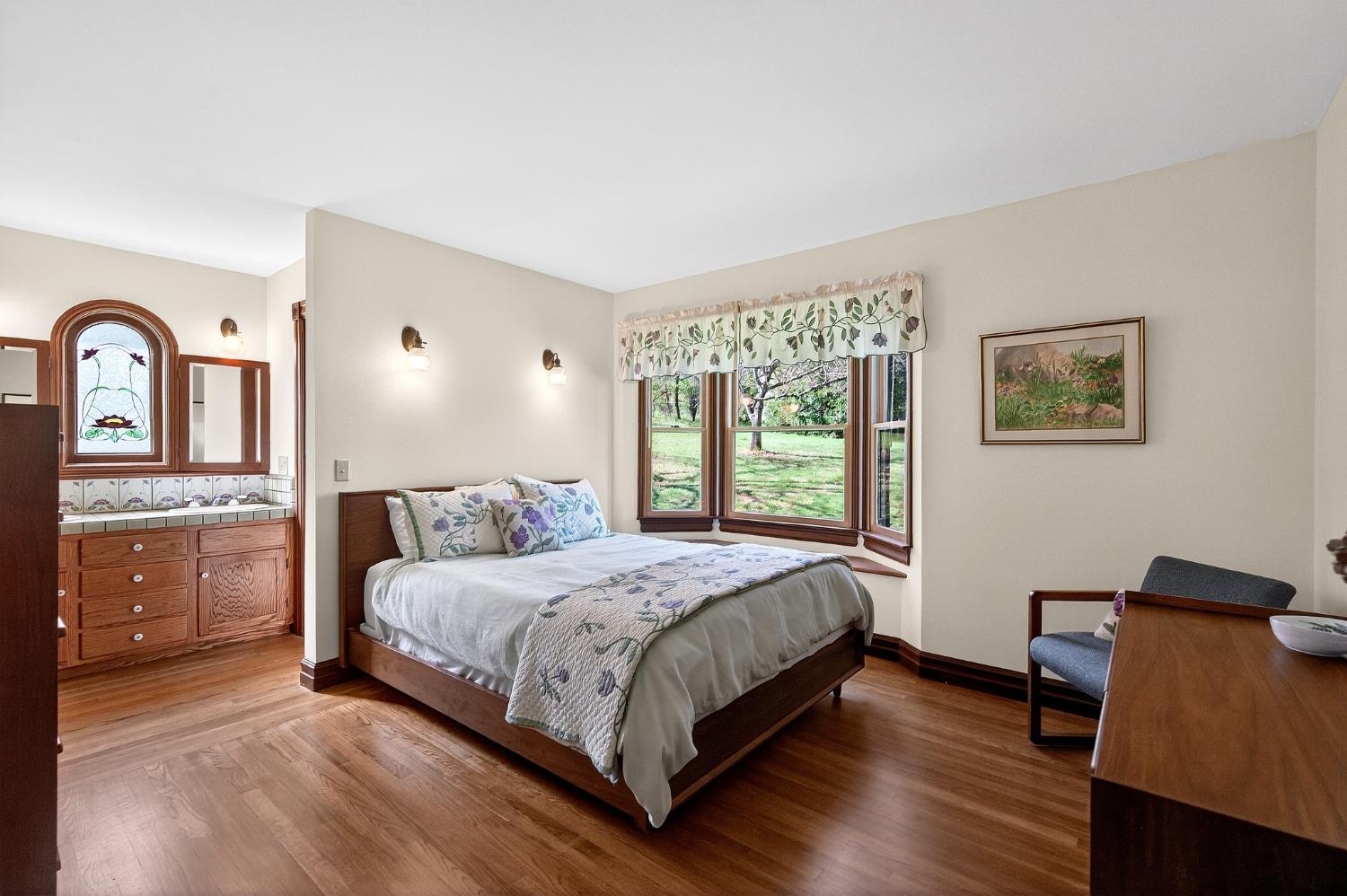 10800 Pickle Barrel Road Auburn, CA 95602 - Photo 24 of 82 a bedroom with a bed and a dresser next to a window