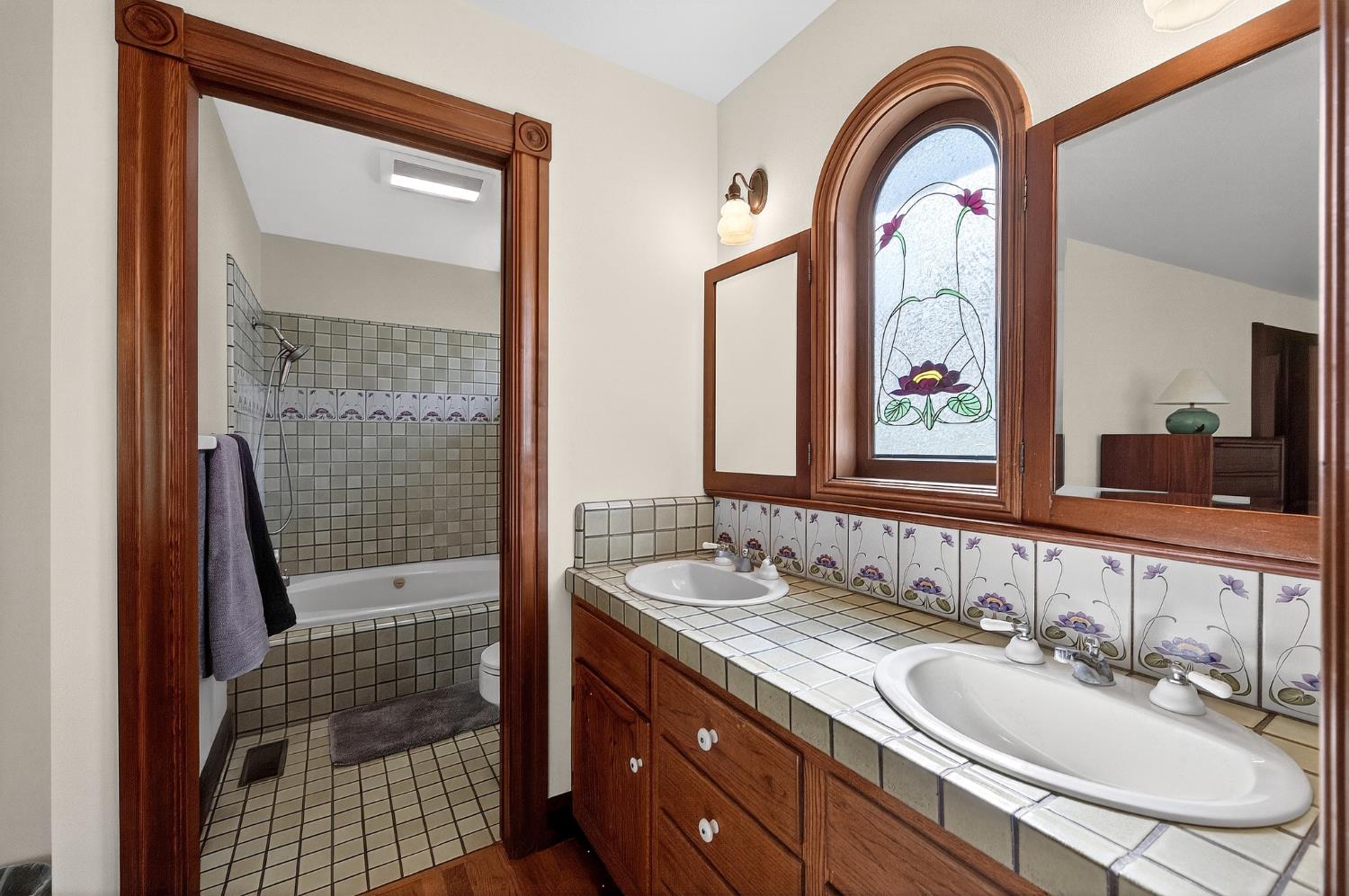 10800 Pickle Barrel Road Auburn, CA 95602 - Photo 26 of 82 a bathroom with a sink a mirror and a shower