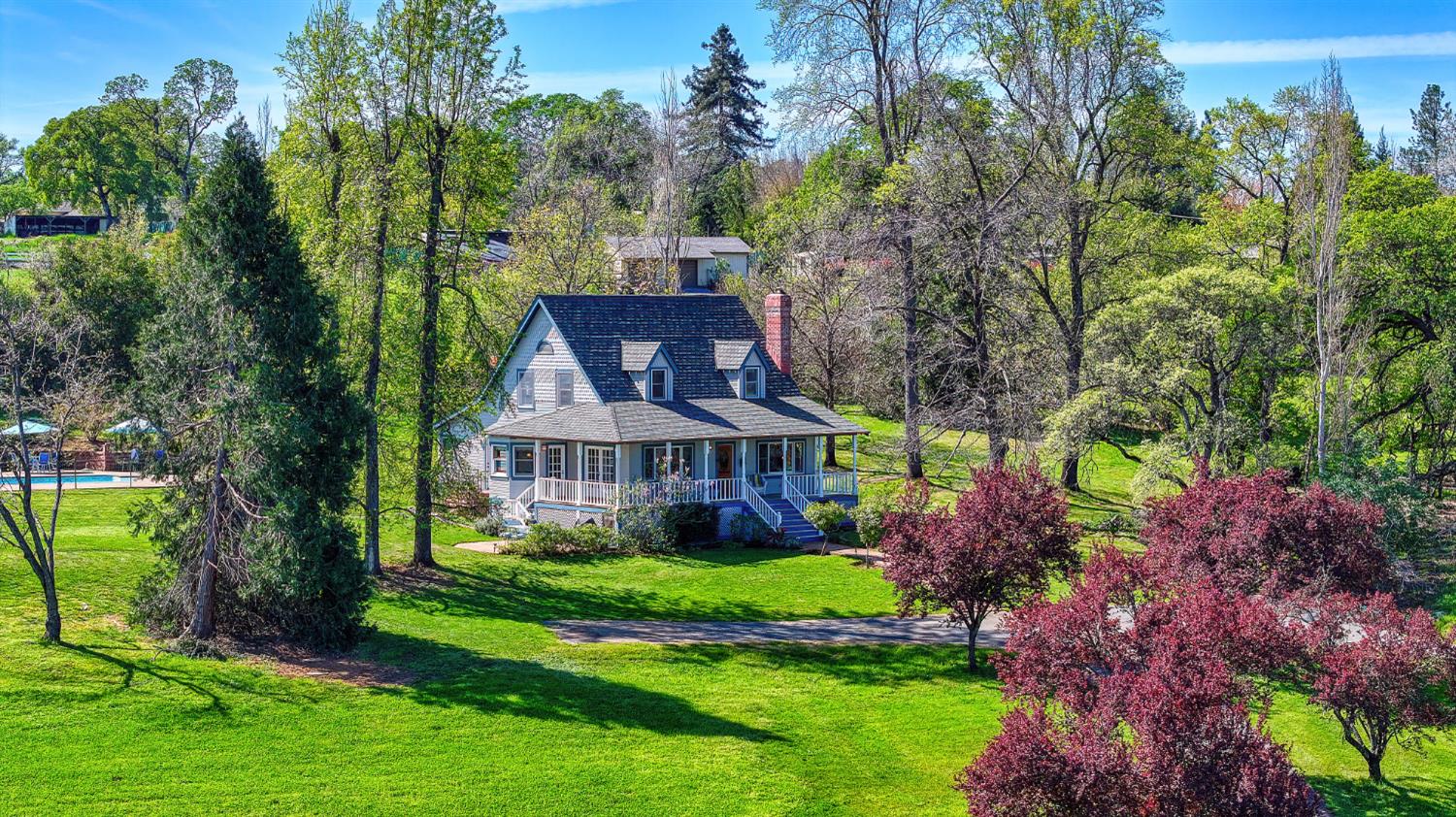10800 Pickle Barrel Road Auburn, CA 95602 - Photo 3 of 82 a front view of a house with a garden and trees