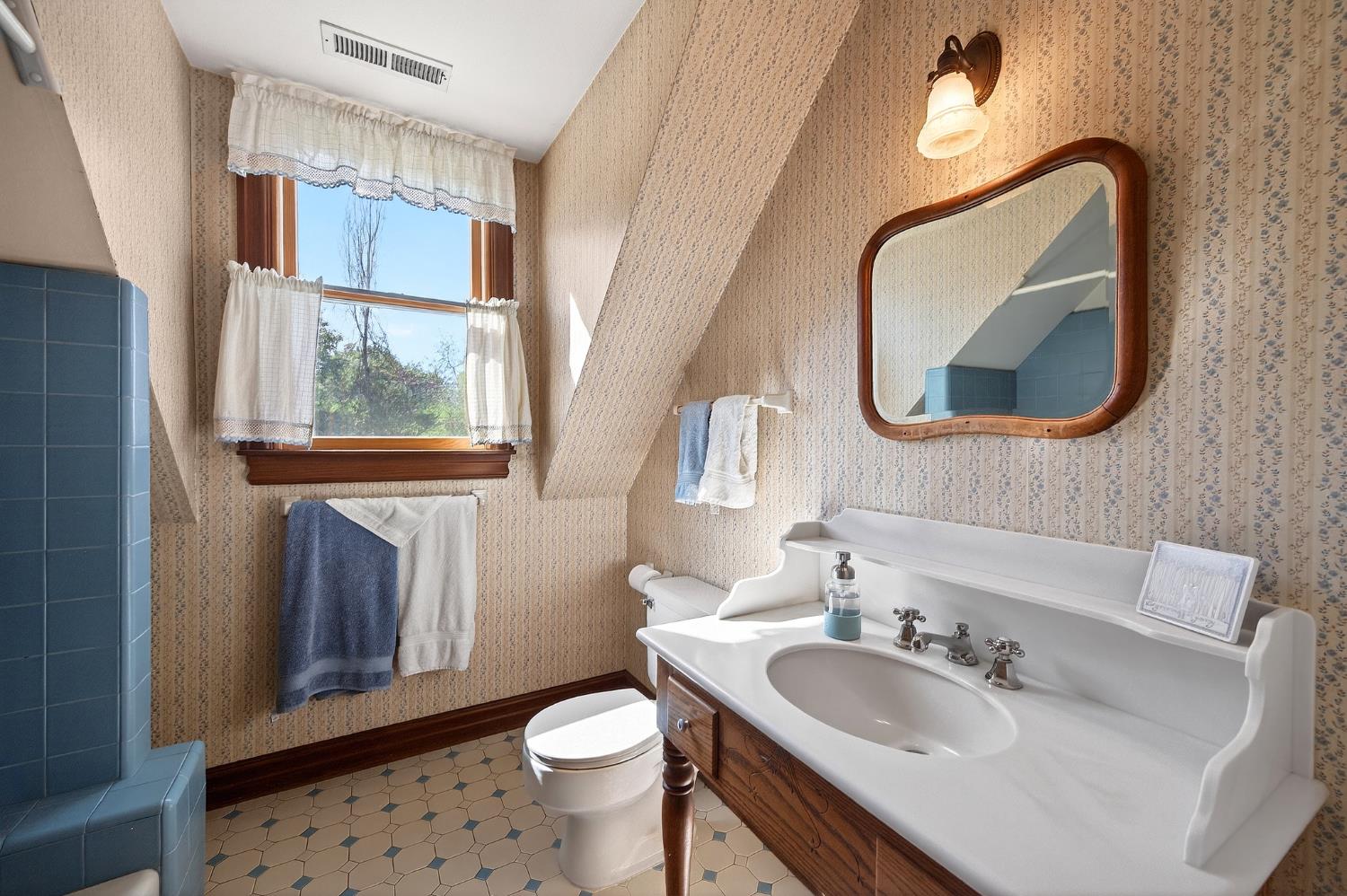 10800 Pickle Barrel Road Auburn, CA 95602 - Photo 32 of 82 a bathroom with a toilet sink and mirror