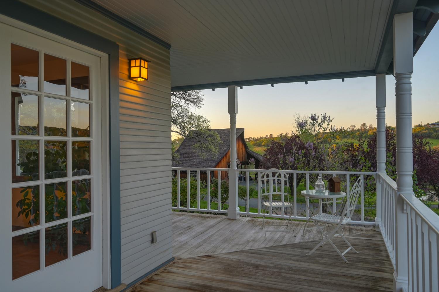 10800 Pickle Barrel Road Auburn, CA 95602 - Photo 64 of 82 a view of a balcony with a floor to ceiling window and wooden floor