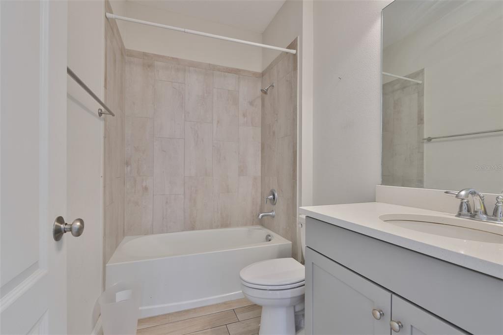5418 Silver Sun Drive Apollo Beach, FL 33572 - Photo 29 of 65 a bathroom with a sink a toilet and shower