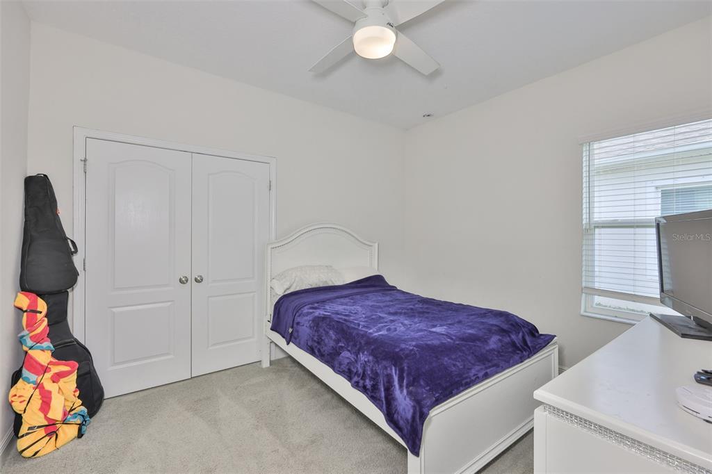 5418 Silver Sun Drive Apollo Beach, FL 33572 - Photo 30 of 65 a spacious bedroom with a bed and a window