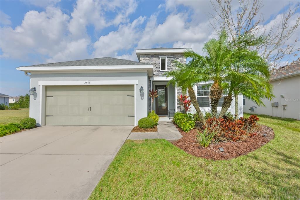 5418 Silver Sun Drive Apollo Beach, FL 33572 - Photo 3 of 65 a front view of a house with garden