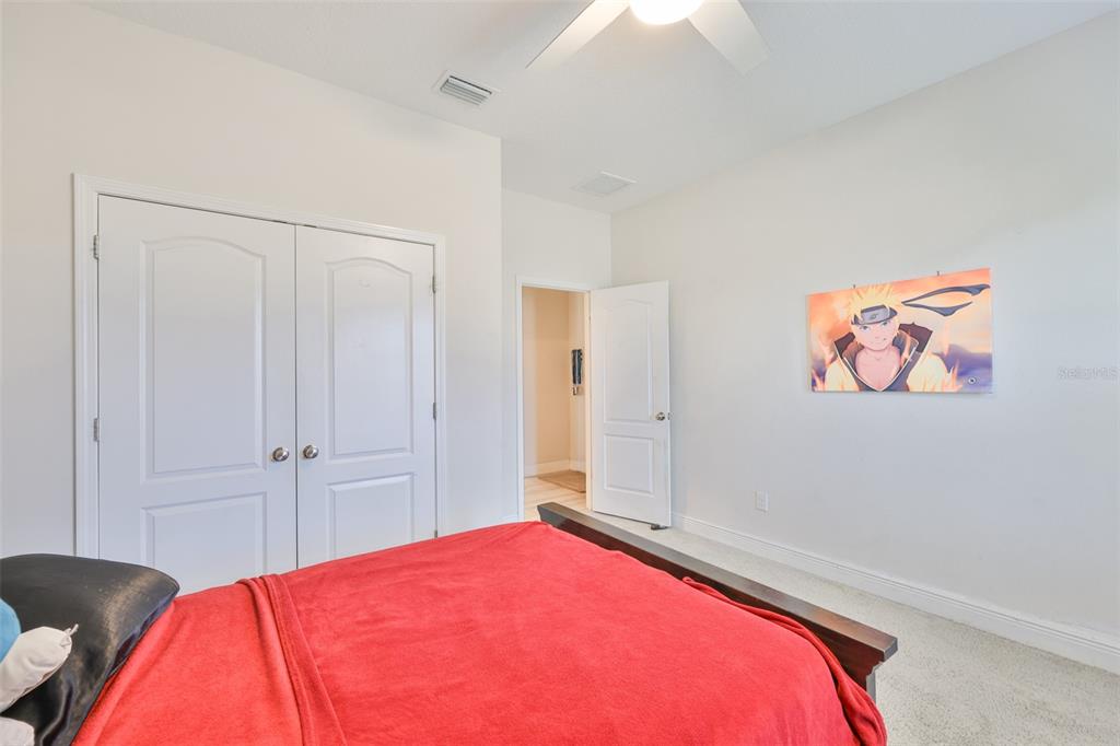 5418 Silver Sun Drive Apollo Beach, FL 33572 - Photo 35 of 65 a bedroom with a bed and a painting on the wall