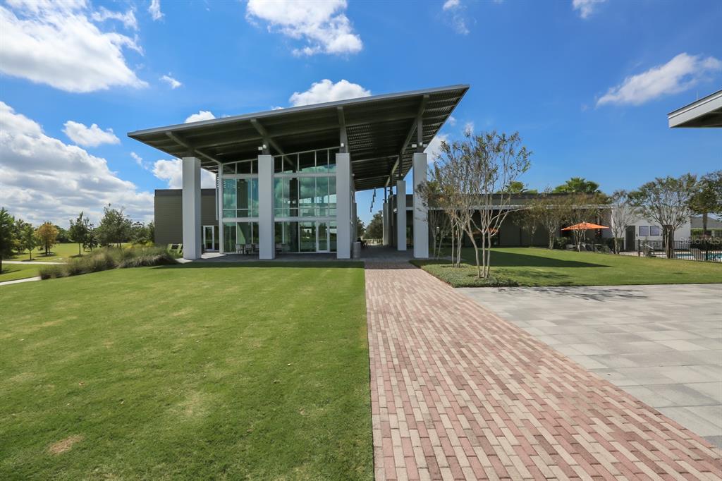 5418 Silver Sun Drive Apollo Beach, FL 33572 - Photo 41 of 65 a view of a patio with table and chairs under an umbrella