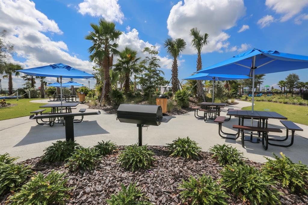 5418 Silver Sun Drive Apollo Beach, FL 33572 - Photo 50 of 65 a swimming pool with outdoor seating and yard