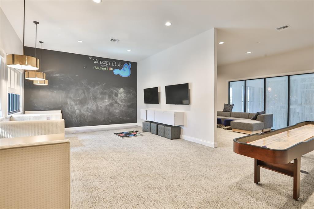 5418 Silver Sun Drive Apollo Beach, FL 33572 - Photo 54 of 65 a living room with furniture and a flat screen tv