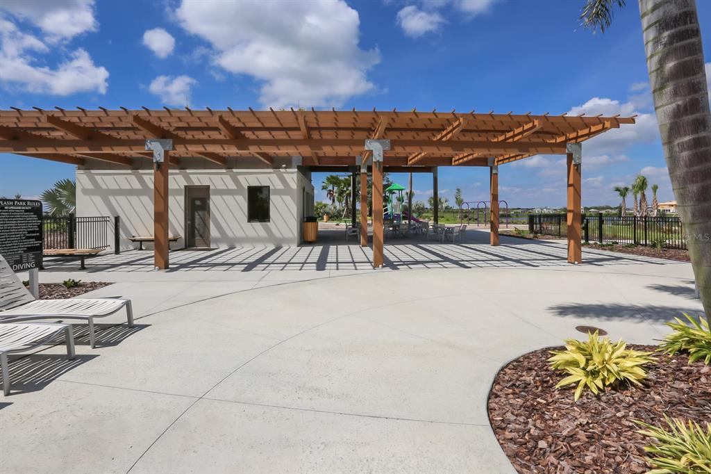 5418 Silver Sun Drive Apollo Beach, FL 33572 - Photo 59 of 65 a view of a swimming pool with an outdoor seating