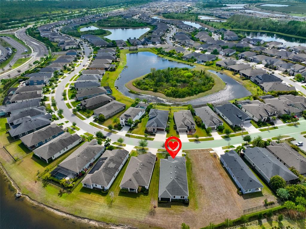 5418 Silver Sun Drive Apollo Beach, FL 33572 - Photo 8 of 65 an aerial view of a house with yard swimming pool and outdoor seating