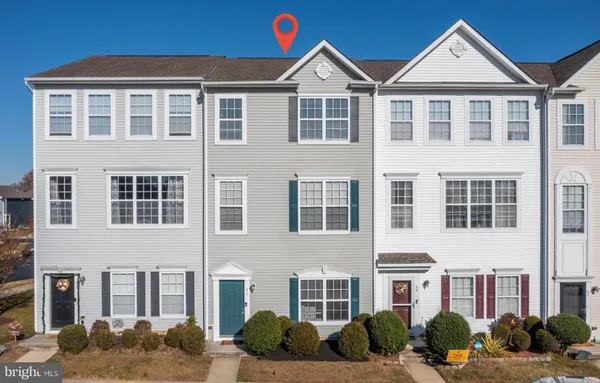 a front view of a residential apartment building with windows
