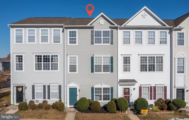 a front view of a residential apartment building with windows