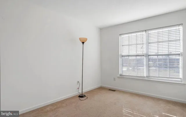 a bathroom with a granite countertop sink a mirror and vanity