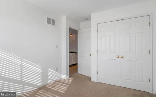 a view of a room with an entryway